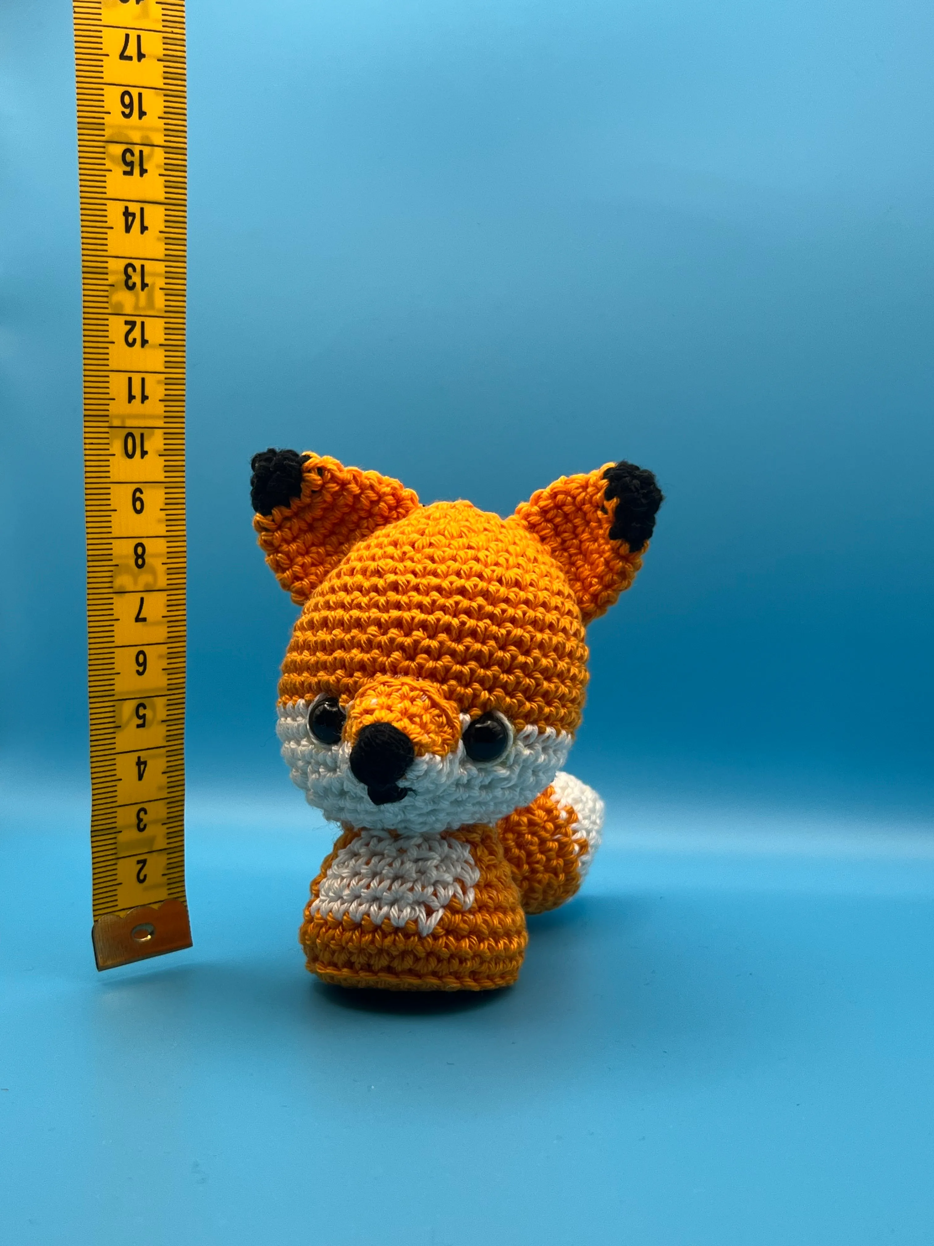 Side view of the fox’s long crocheted tail