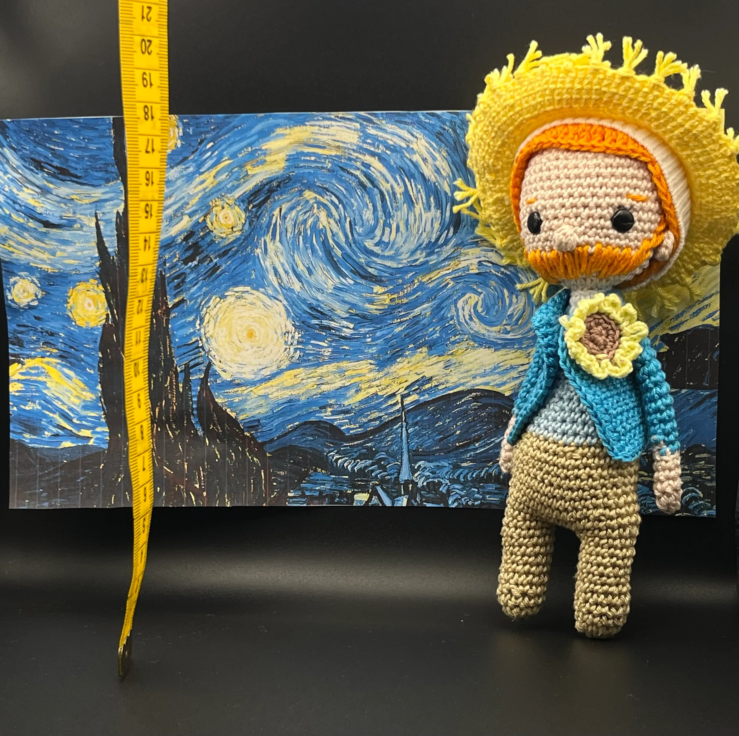 Close view of Van Gogh’s embroidered face and colourful clothes