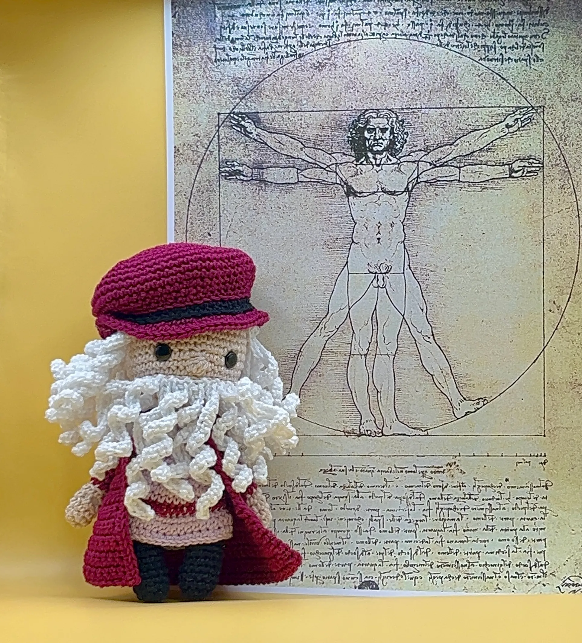 Leonardo amigurumi showing his long silver yarn hair and beard