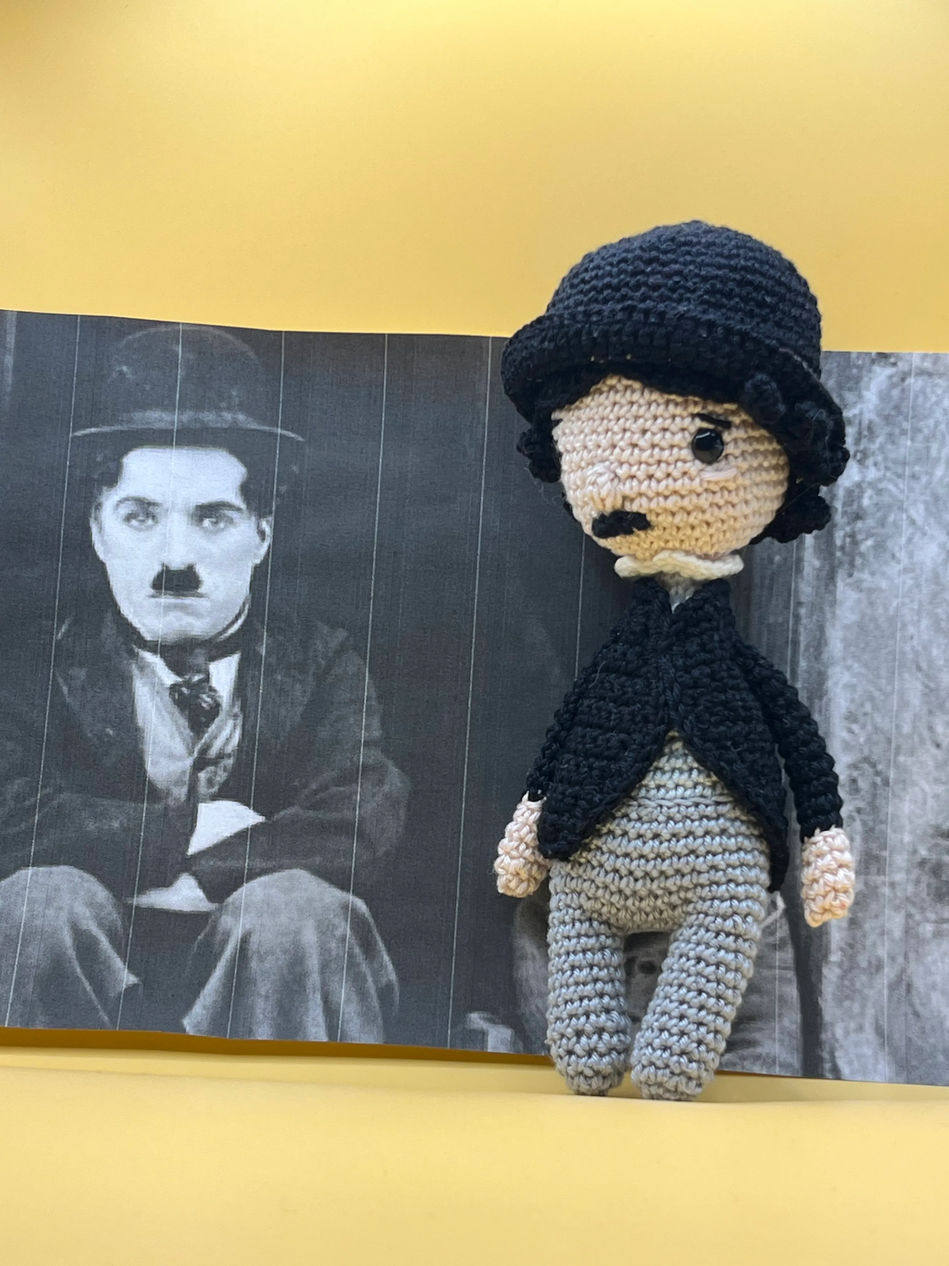 Charlie Chaplin amigurumi showing the black bowler hat and small moustache
