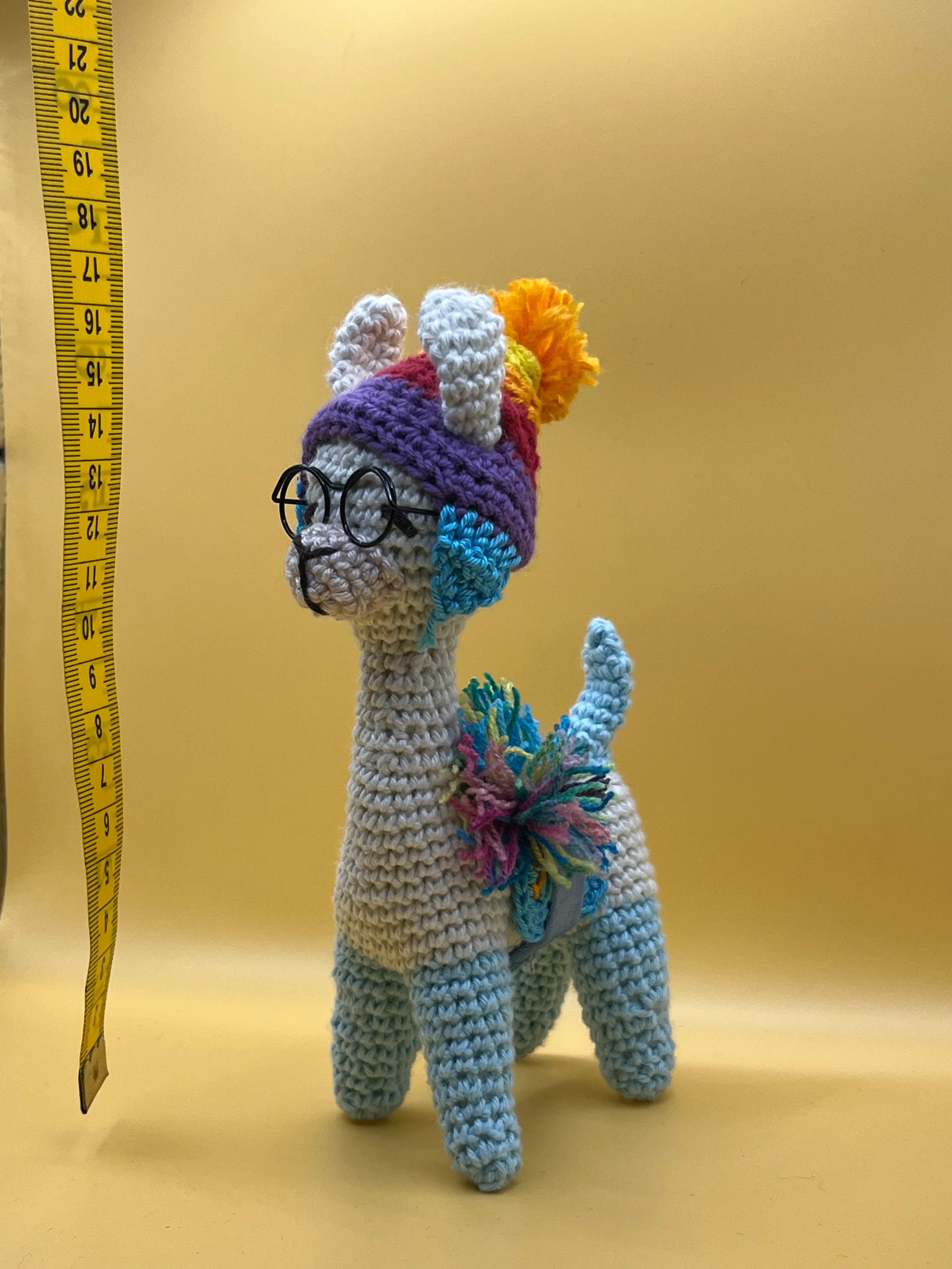 Alternate view of the llama’s cream and grey textured body