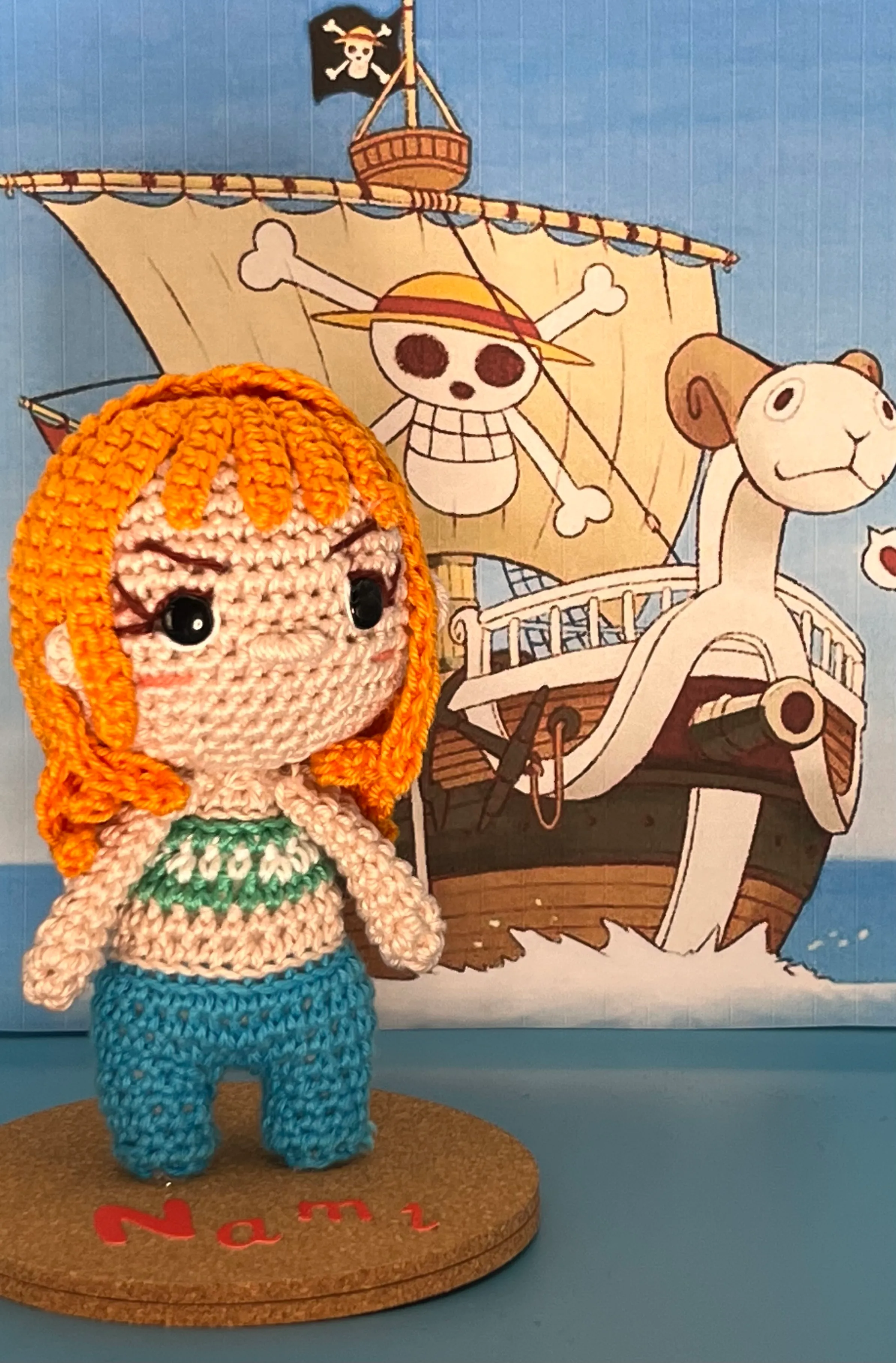 Closer view of Nami’s crocheted orange hair and embroidered expression