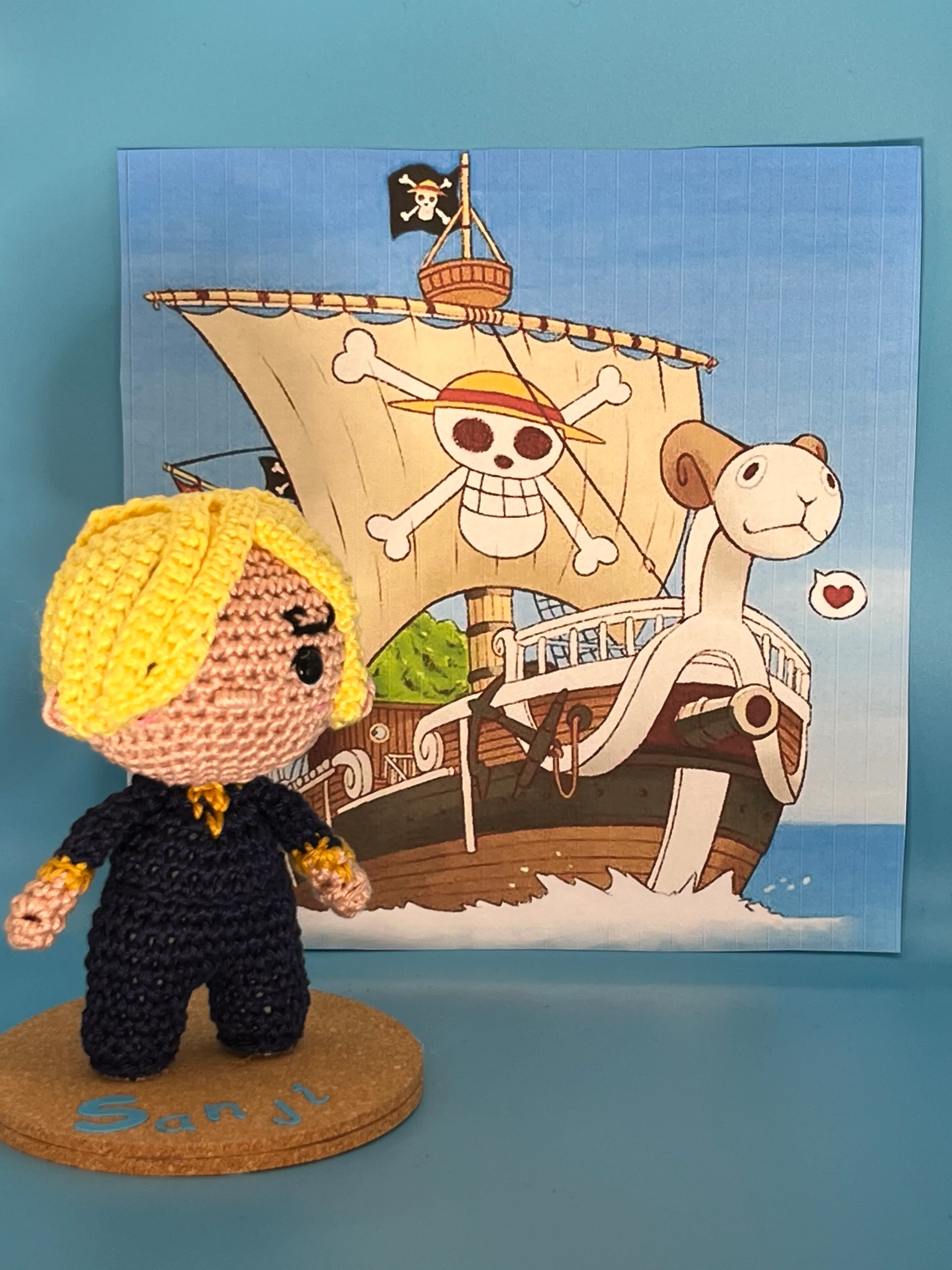 Closer view of Sanji’s blond crocheted fringe and dark suit