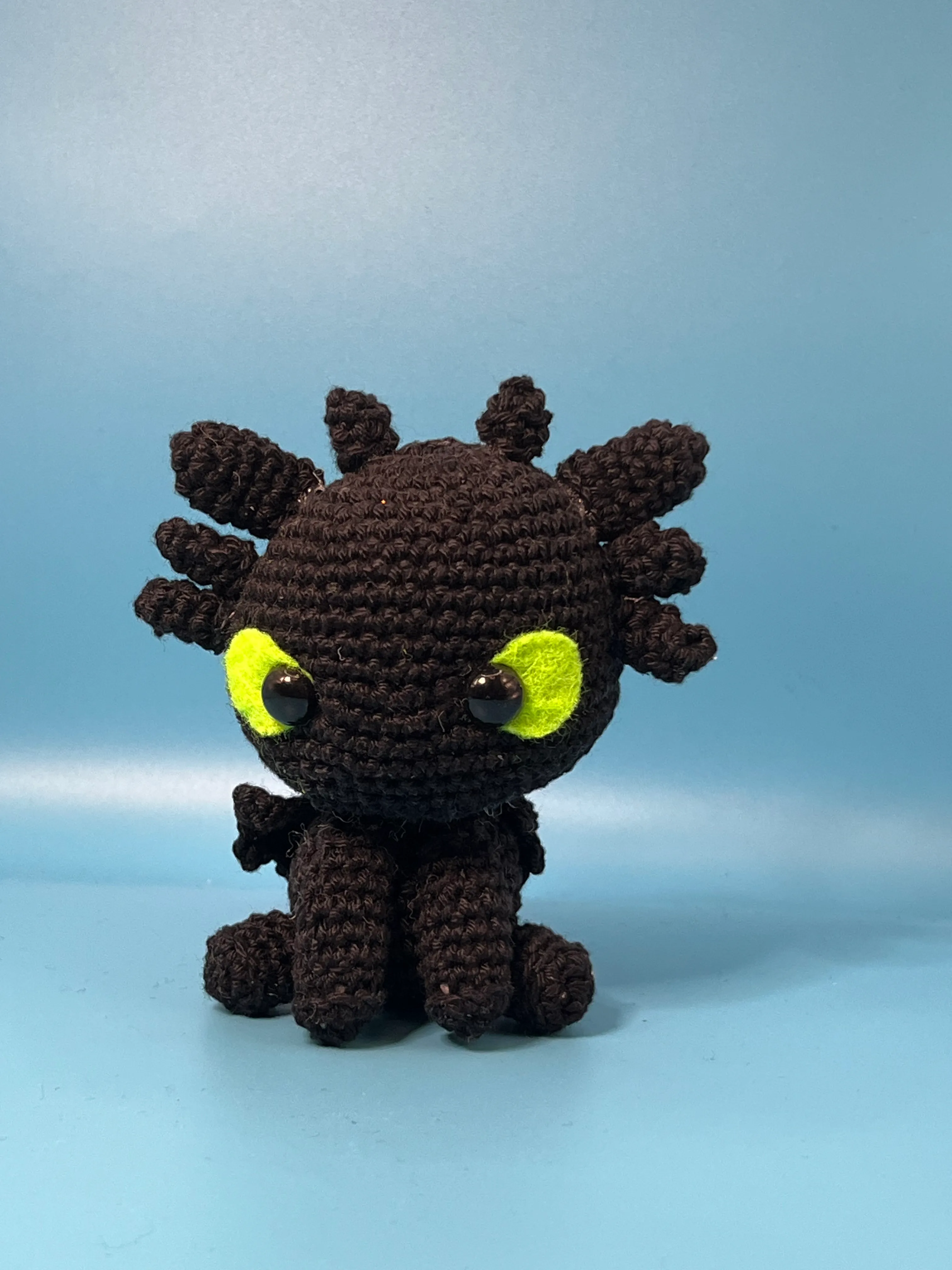 Close view of Toothless’s large green eyes and rounded snout