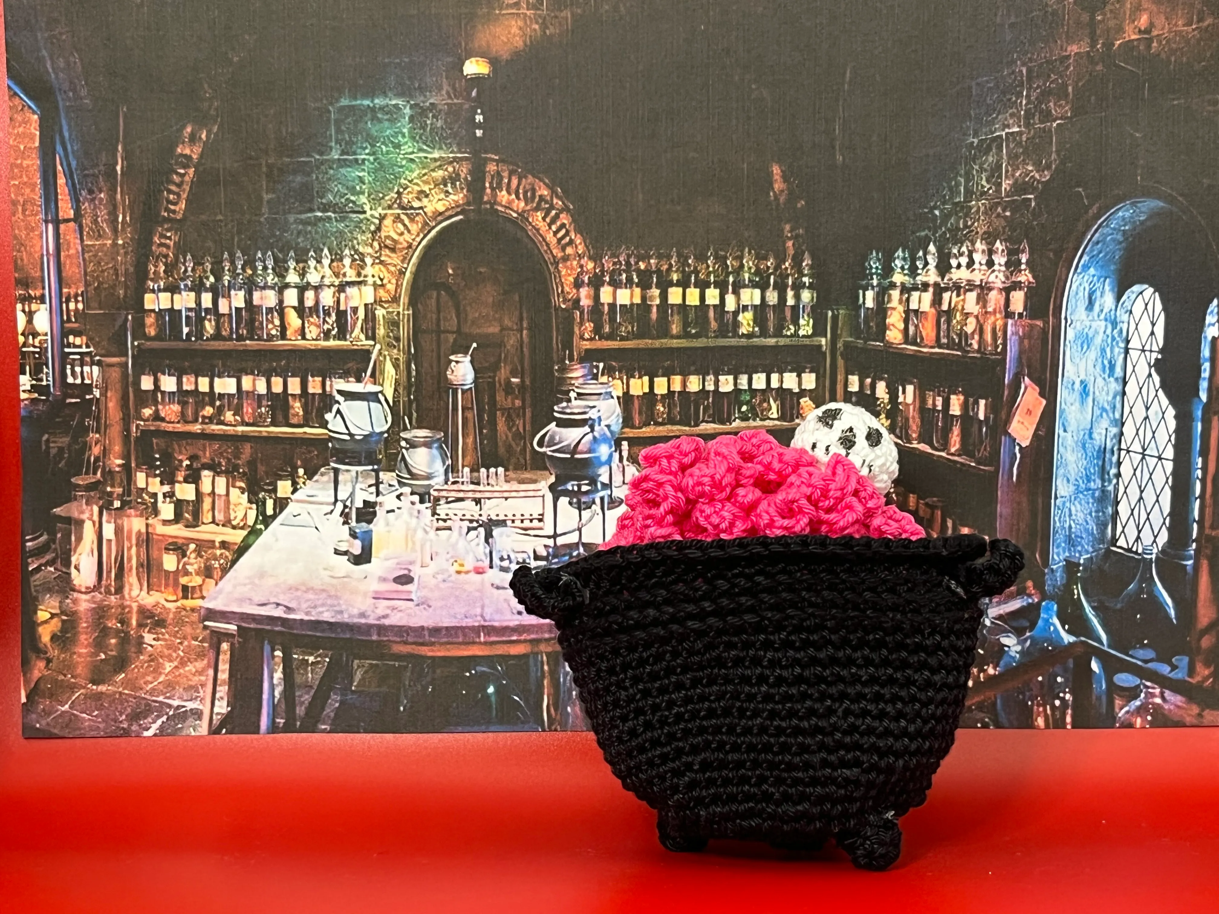 Alternate view of the witch’s bright yarn curls and black skirt