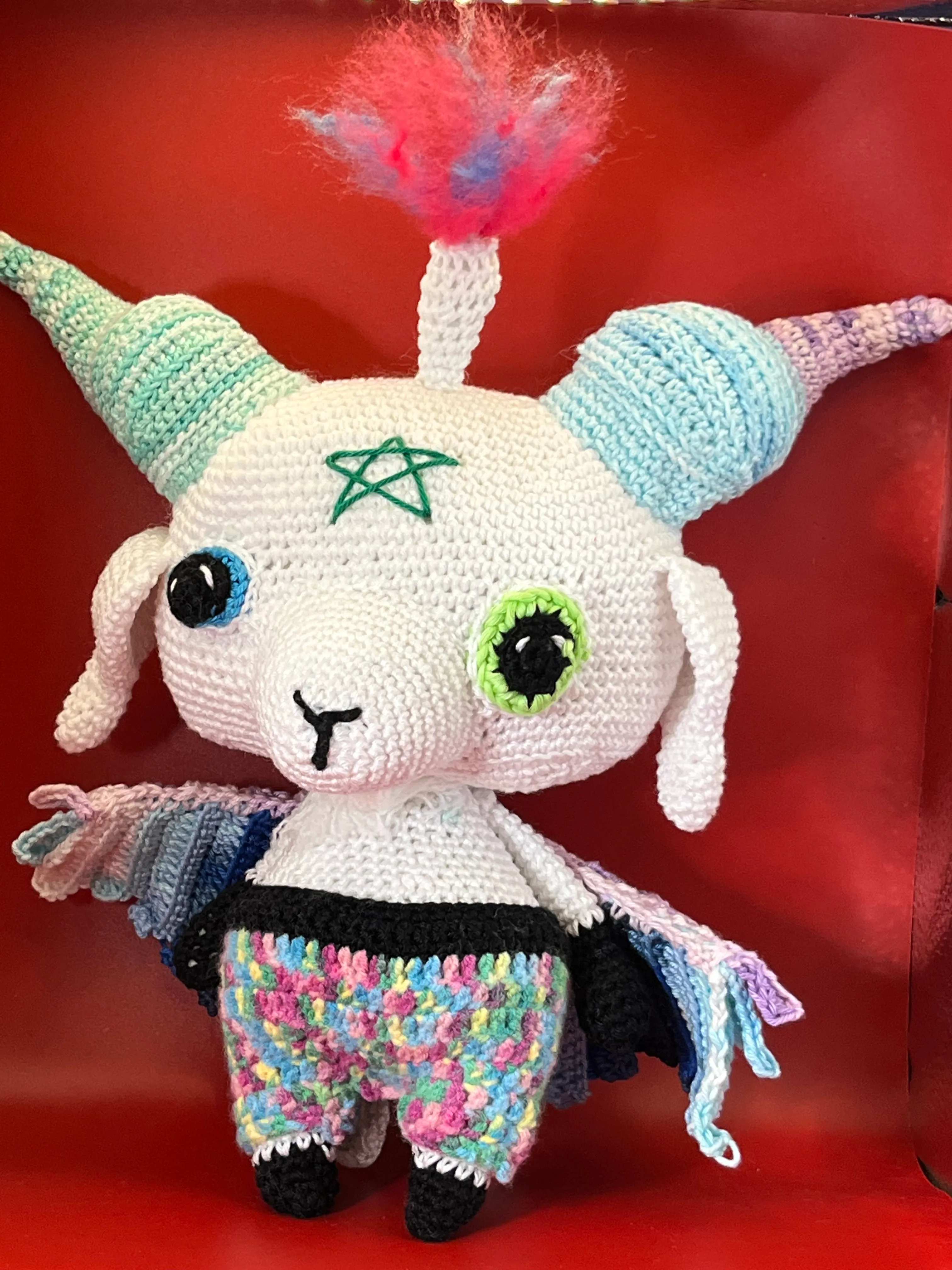 Detail of the crocheted wings and embroidered symbols on Baphomet