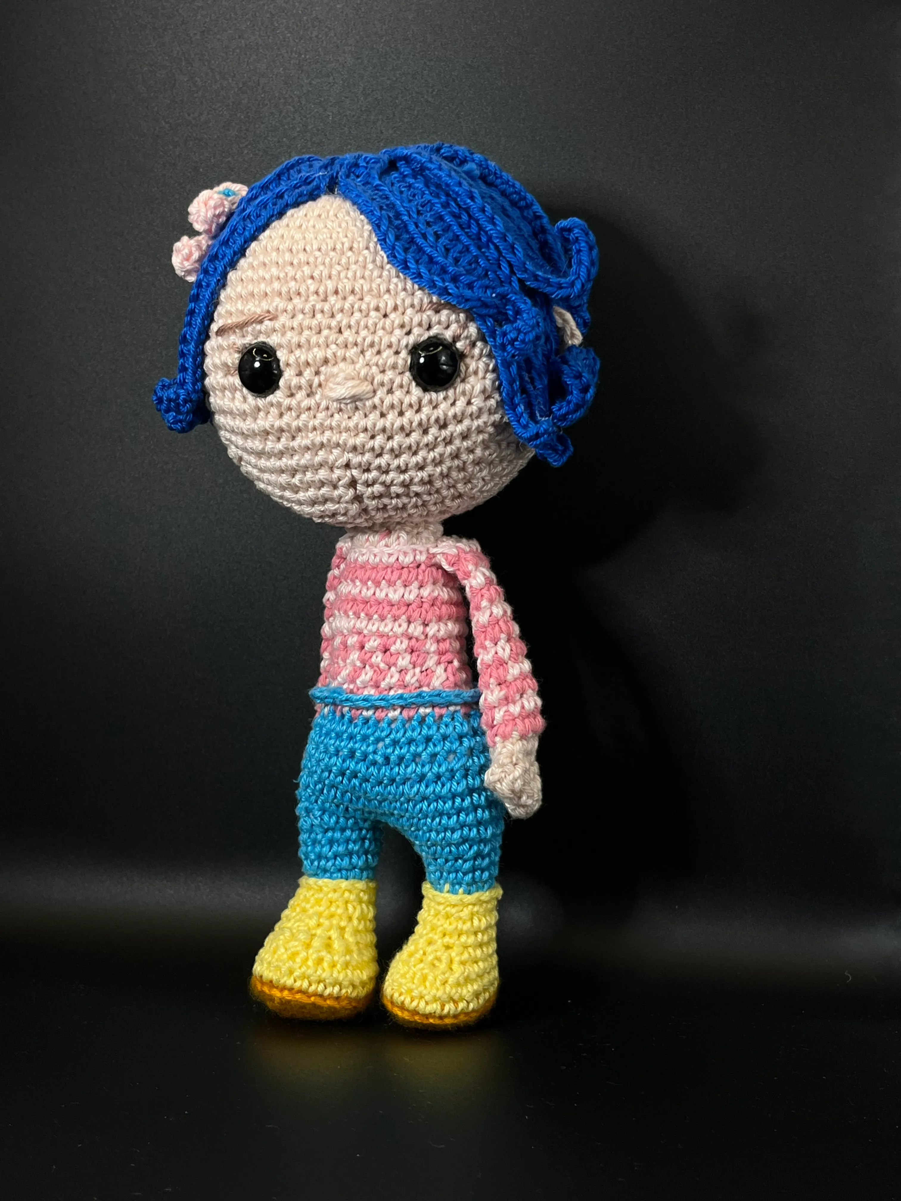 Alternate view of Coraline’s handmade clothes and blue trousers