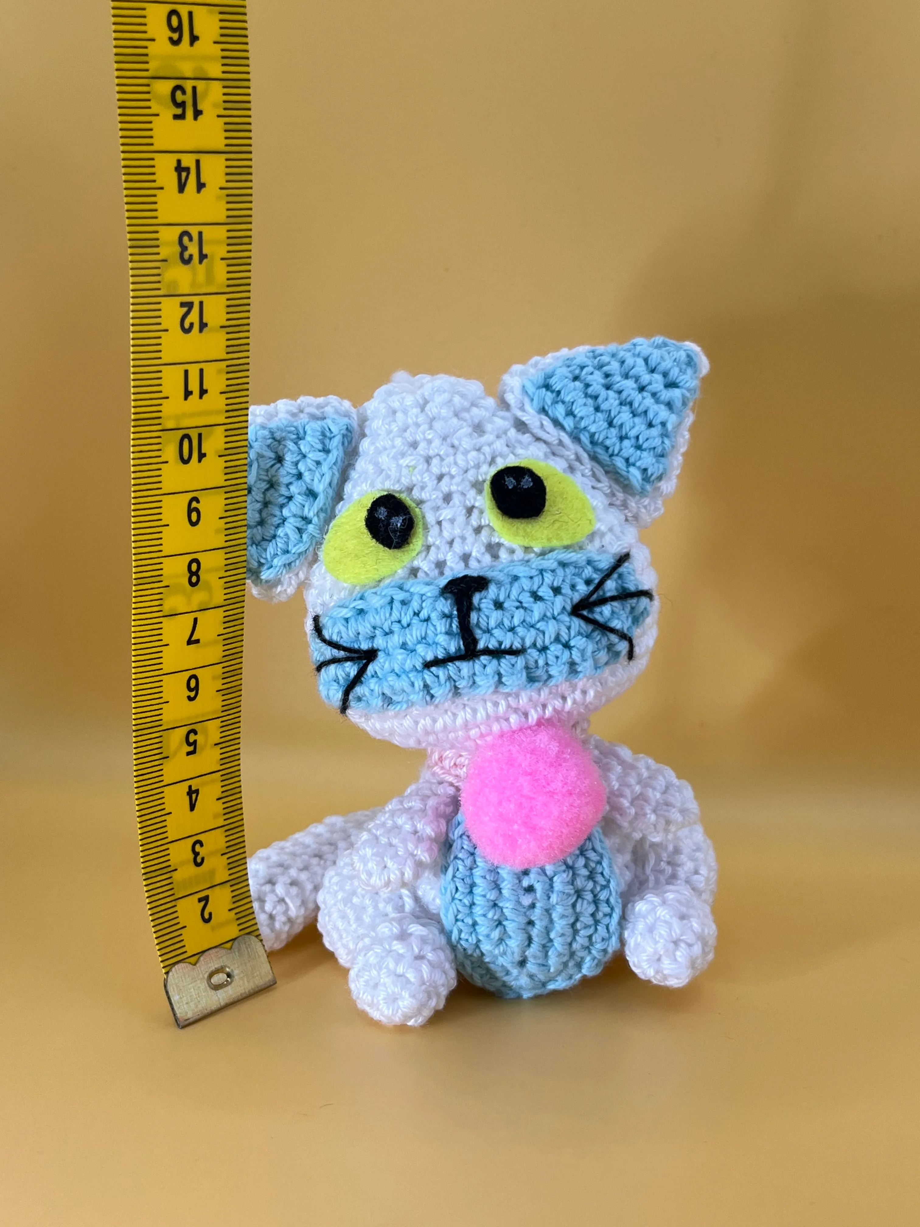 Close view of Posi’s embroidered expression