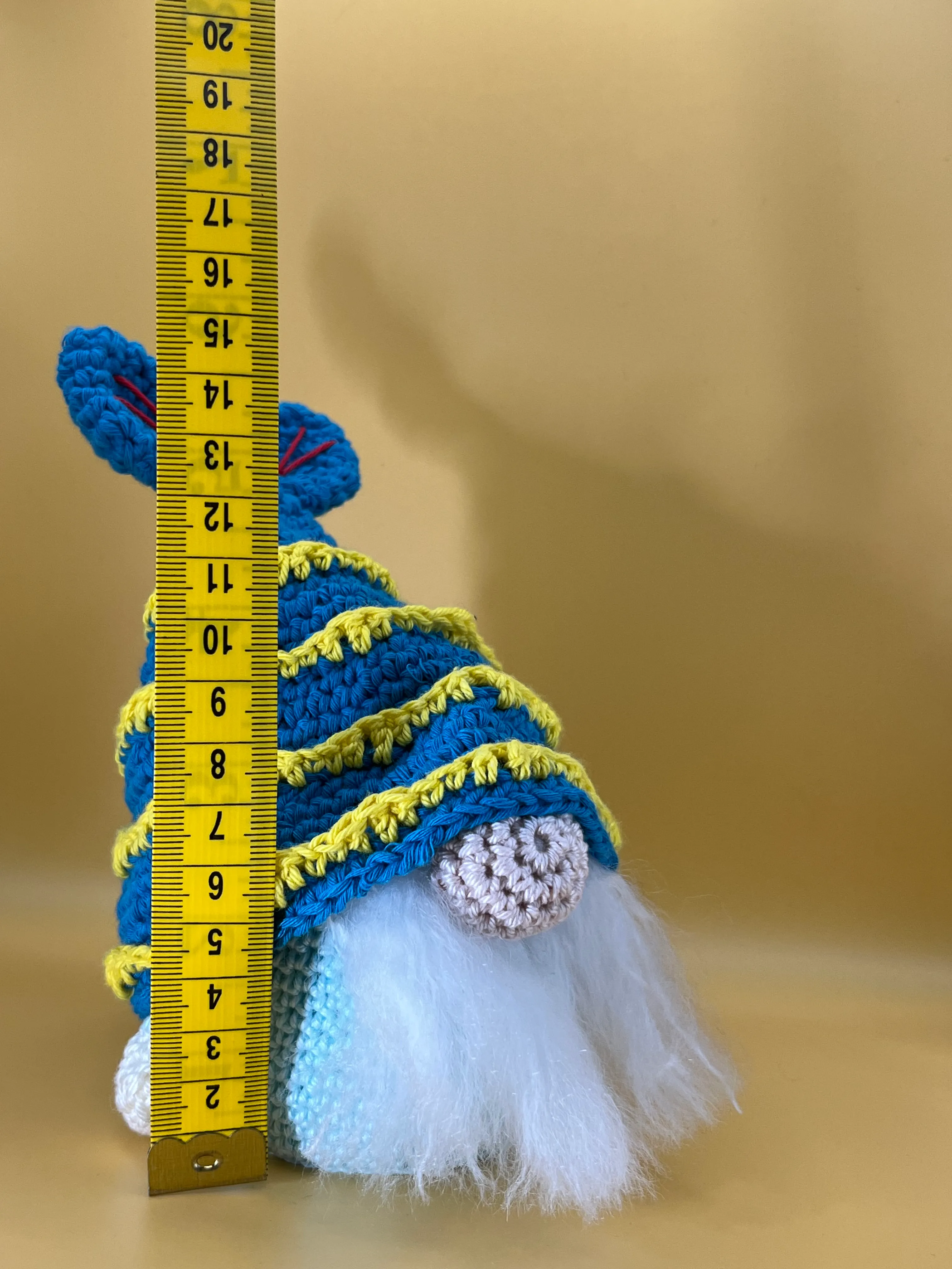 Close view of the Pisces symbols, white beard, and ocean-coloured details